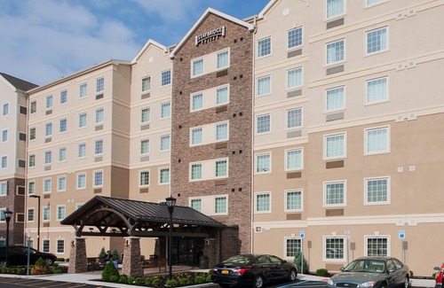 Amherst Condo | Equipped Suite | Free Daily Breakfast, Pool Access + Gym Access