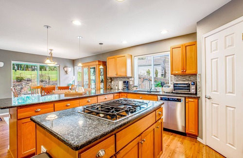 Allyn House | Fairway-view home with deck, grill, central AC, game room, Ping-Pong, & WiFi