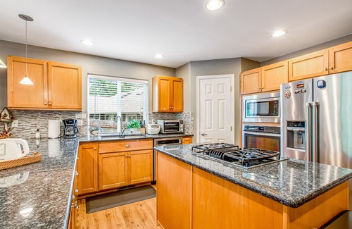 Allyn House | Fairway-view home with deck, grill, central AC, game room, Ping-Pong, & WiFi