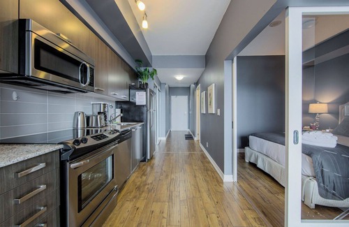 Bay Cloverhill Condo | Family Size 1 Bedroom Condo with BALCONY walk to SICK KIDS HOSPITAL. Sleeps 4