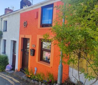 Mumbles House | Fishermen's cottage with log burner, 2 bathrooms & sea views from garden terraces