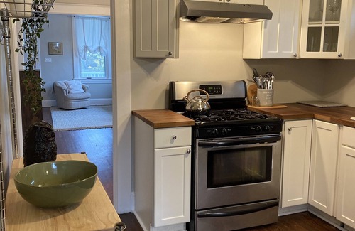 Elkridge House | Four bedrooms, porch and parking! Pet-friendly with a large fenced yard.