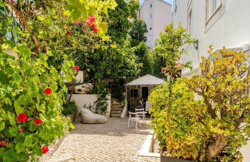 Alfama Apartment | Fragrant Apt with Private Garden in Historic Graça