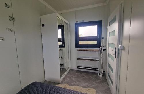 Wielun Villa | GRETA Nowoczesny domek modułowy nad stawem