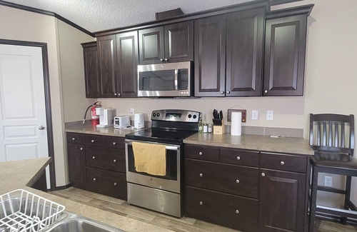 Stettler House | Guest suite in town-2 bedrooms/private kitchen