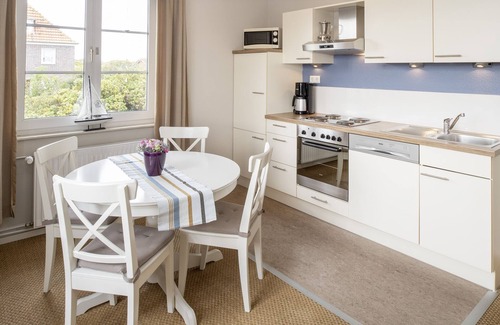 Langeoog Apartment | Helle Ferienwohnung auf Langeoog mit Gartennutzung für bis zu Vier Personen