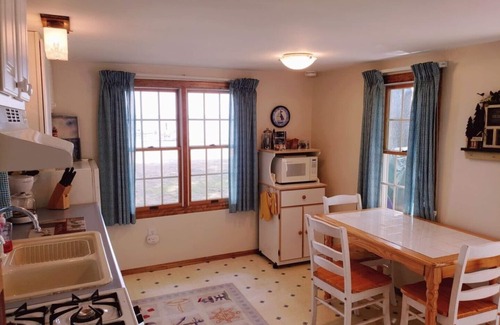 Higgins Lake House | Higgins Lakefront Cozy Beach House with Private Boat Mooring Onsite - Brass Bell