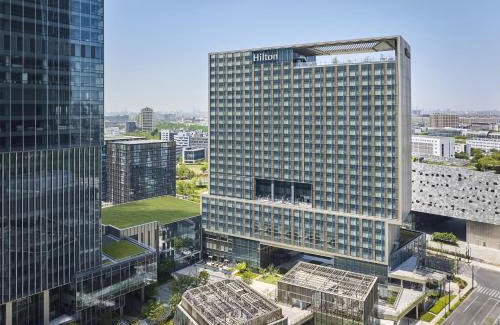 Pudong Hotel | Hilton Shanghai Zhangjiang Science City - Shuttle bus to Shanghai Disney Resort and Shanghai New International Expo Centre during exhibition period and 30 minutes drive to PVG