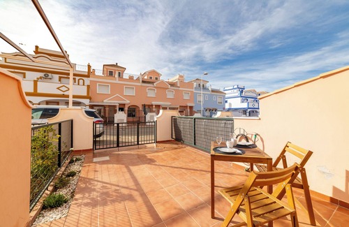 San Juan de los Terreros House | Holiday Home "Adosado El Invencible" with Sea View, Shared Pool & Wi-Fi