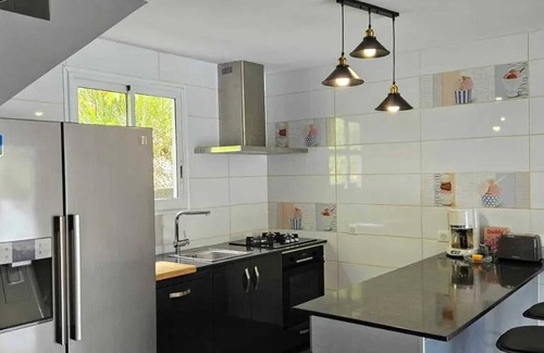 Bas Vent House | Homerez - Spacious House in Deshaies with Shared Pool