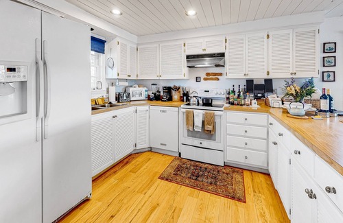 Marvel House | Idyllic rural home with private pond, river access, pool, patio, & covered decks