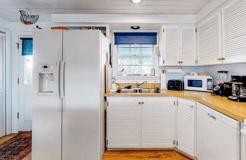 Marvel House | Idyllic rural home with private pond, river access, pool, patio, & covered decks