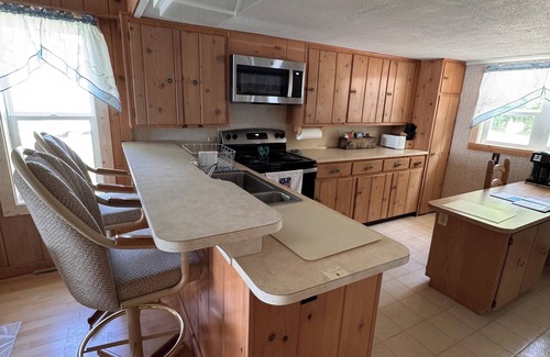 Fountain Cottage | Lakefront cottage with sandy beach and great fishing on Gunn Lake in Fountain MI