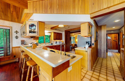 Lake Tomahawk House | Lakefront home on South Two Lakes with lake views, lake access, firepit, & dock