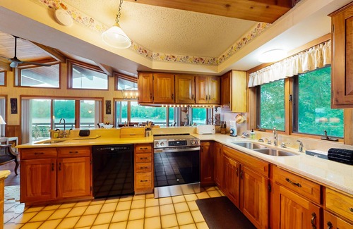 Lake Tomahawk House | Lakefront home on South Two Lakes with lake views, lake access, firepit, & dock