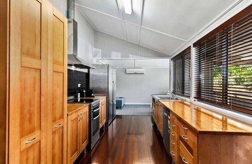 Urangan House | Large Waterfront Home With Pool - CoastHM