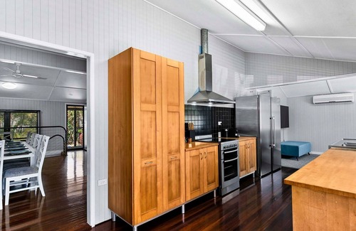 Urangan House | Large Waterfront Home With Pool - CoastHM