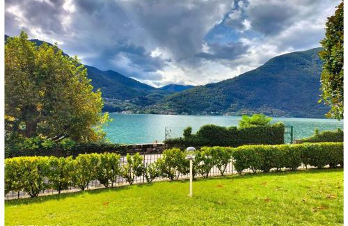 Cima Apartment | LFSUITE LuganoLake Terrazza Spiaggia privata Parking WI-FI Netflix