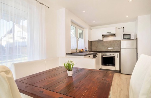 Enzisweiler Apartment | Light-flooded and Modern Apartment “Gartenstraße” with Terraces and Garden