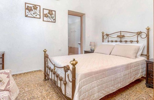 Longos Apartment | Located in the most enviable position, with uninterrupted views of Loggos Harbour and the sea, sits