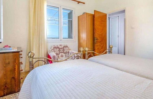 Longos Apartment | Located in the most enviable position, with uninterrupted views of Loggos Harbour and the sea, sits