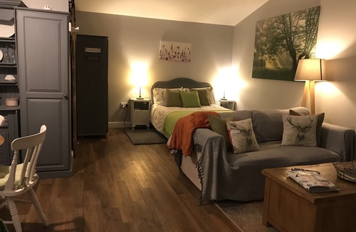 Sandy Lane Cabin | Lovely Wooden Lodge, views over an orchard, outside seating.