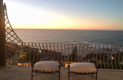 Bantry Bay Villa | Luxurious en-suite bedroom with lounge stunning sea view & balcony in Bantry Bay