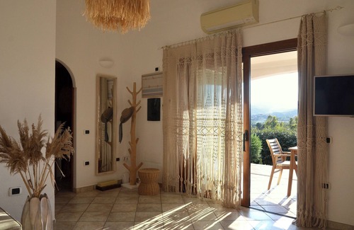 Tanaunella Villa | Luxury retreat 300 metres from the sea, with heated pool, fireplace and sauna.