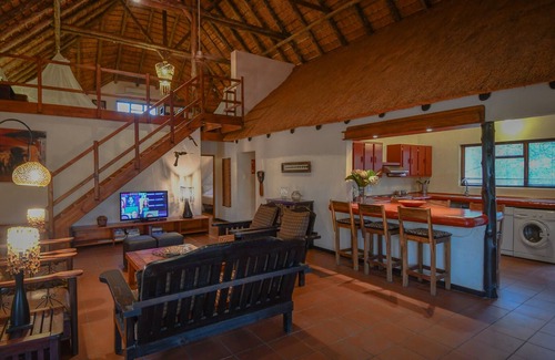 Phalaborwa Villa | Luxury Villa 1 km from Kruger Park veranda overlooking the garden and ponds