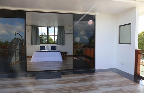 Thulusdhoo Island Bed & Breakfast | Master Suite Family Room with views of the Ocean