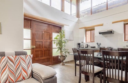 Huaran House | Modern and comfortable house with stunning views of the mountains and waterfall.