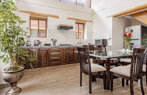 Huaran House | Modern and comfortable house with stunning views of the mountains and waterfall.