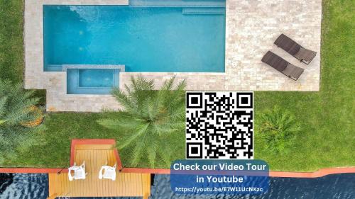 North Corals House | New! Waterfront Heated Pool & Jacuzzi 2 mi to Beach - Fishing Pier Relaxing SPA & Hammock