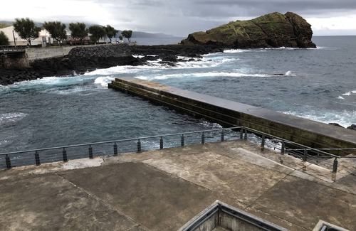 Ponta Delgada House | Oceanfront studio with private cobblestone patio and direct access to ocean pool