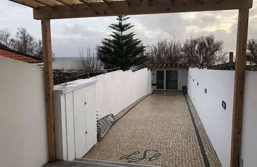 Ponta Delgada House | Oceanfront studio with private cobblestone patio and direct access to ocean pool