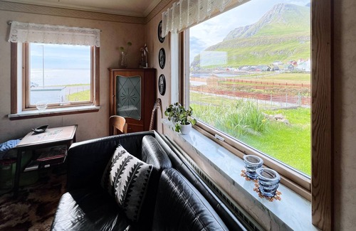 Faroe Islands House | Older cozy house with a lovely view of ocean and cliffs