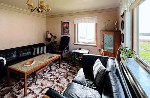 Faroe Islands House | Older cozy house with a lovely view of ocean and cliffs