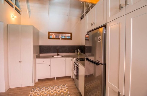 Playa Guiones House | Only steps to the surf and a short walk to yoga, this modern casita sleeps 6.