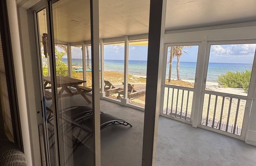 West End House | Private 2-b beachfront cottage w/hammocks, screened-in veranda, sunsets & more!