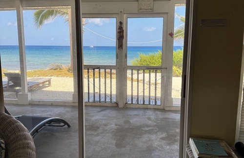 West End House | Private 2-b beachfront cottage w/hammocks, screened-in veranda, sunsets & more!