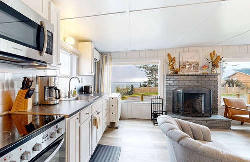 Netarts House | Quaint oceanfront hideaway with open layout, fireplace, central AC, & gas grill