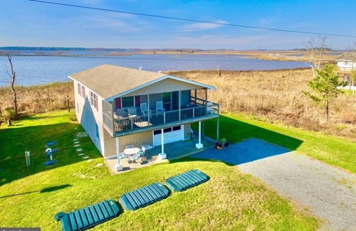 Prime Hook Beach House | Quiet dog friendly home overlooking nature preserve, 1 block from private beach.