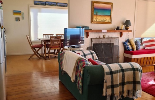 Pakawau Cottage | Quiet Pakawau beachfront bach - beautiful views of Golden Bay and Farewell Spit.