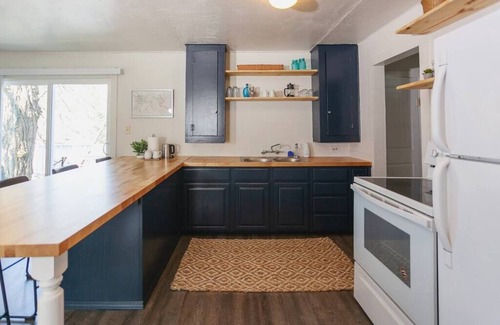 Gold Hill Cottage | R&R on the Rogue River! This 2 BR cottage in Gold Hill features a private hot tub with stunning scenic views. Enjoy a spacious, private setting perfect for relaxation, adventure, or remote work