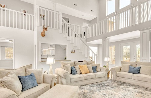 Seven Coves House | Relax and unwind on the deck with water view of Lake Conroe