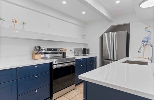 Matagorda Condo | Relax poolside with the whole family or hunt shells on the beach.