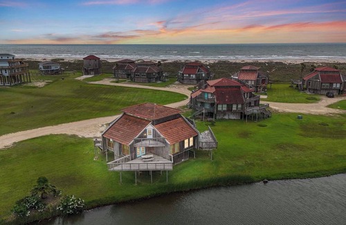 Matagorda Condo | Relax poolside with the whole family or hunt shells on the beach.