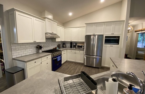 Burley House | Relaxing PNW island getaway with hot tub, fire pit, miles of trails & beaches.