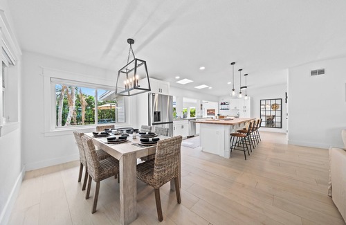 Venetian Way House | Remodeled Riverfront Pool and Dock Home in the Heart of Cocoa Beach.