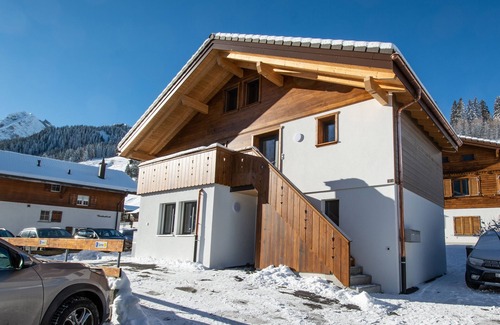 Adelboden Apartment | right on the ski hill, a cozy 2 bedroom with living room apartment fits 6 people